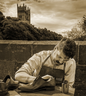 Hand Made Shoes
Guy finishing shoes by hand dyeing
Keywords: shoes craftsman